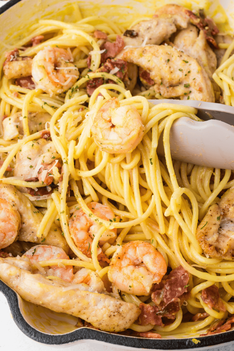 Copycat Olive Garden Chicken and Shrimp Carbonara with creamy garlic Parmesan sauce, chicken, shrimp, and pasta.