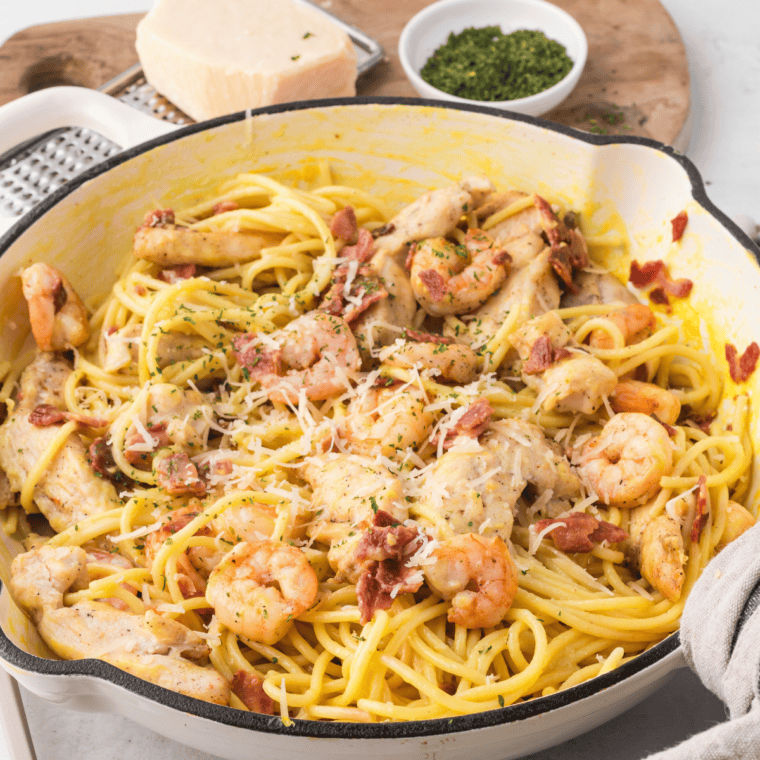 Copycat Olive Garden Chicken and Shrimp Carbonara with creamy garlic Parmesan sauce, chicken, shrimp, and pasta.