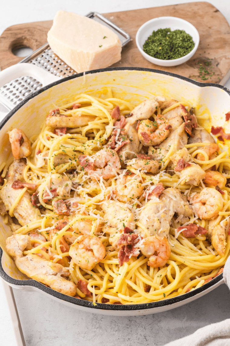 Copycat Olive Garden Chicken and Shrimp Carbonara with creamy garlic Parmesan sauce, chicken, shrimp, and pasta.