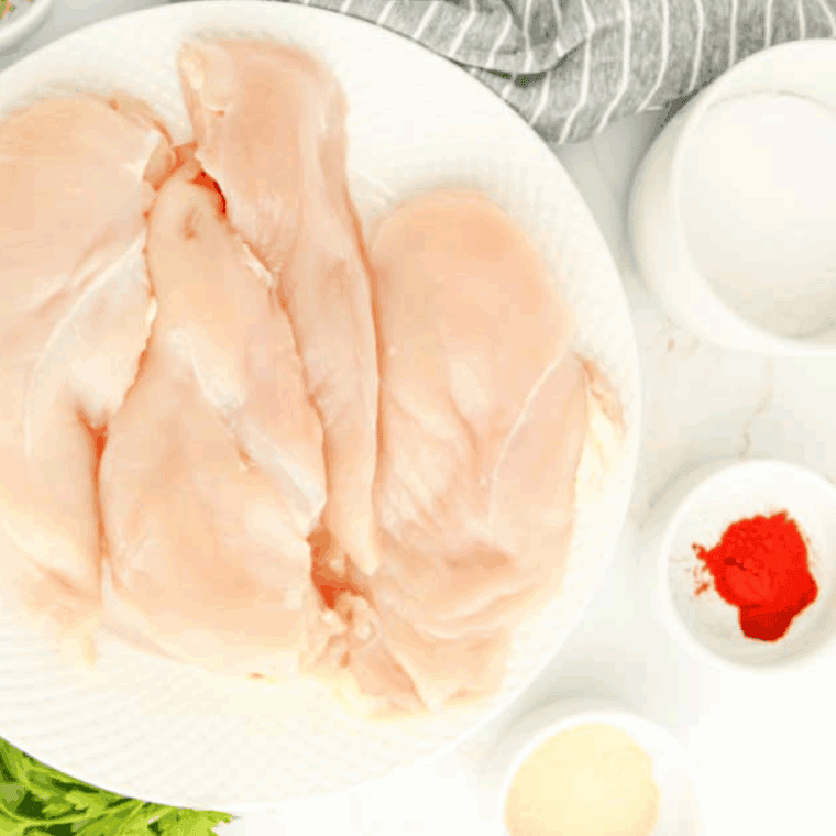 Ingredients needed for Dairy Free Creamy Chicken Soup on kitchen table.