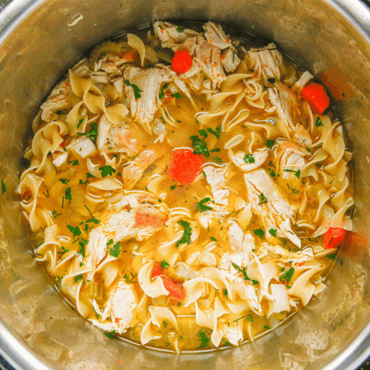 Stirring in dairy-free milk, adjusting seasoning, and serving the creamy soup.