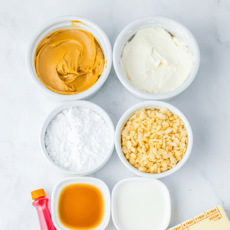 Ingredients needed for Rice Krispie Treats with Marshmallow Fluff on kitchen table.