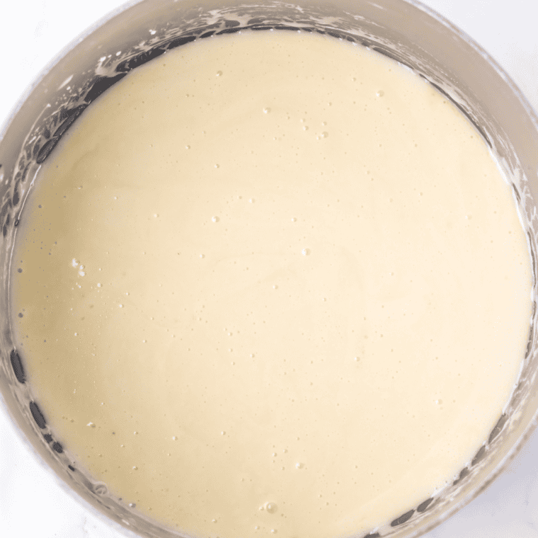 Adding marshmallow fluff to melted butter and stirring until smooth.
