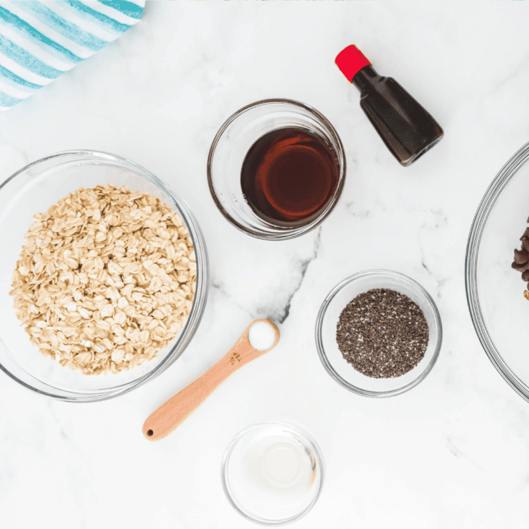 Ingredients needed for Homemade Cinnamon Granola on kitchen table.