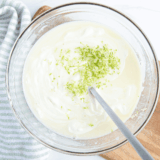 Homemade Key Lime Curd with fresh key limes, creamy texture, and tangy flavor.