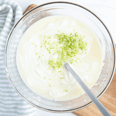 Homemade Key Lime Curd with fresh key limes, creamy texture, and tangy flavor.