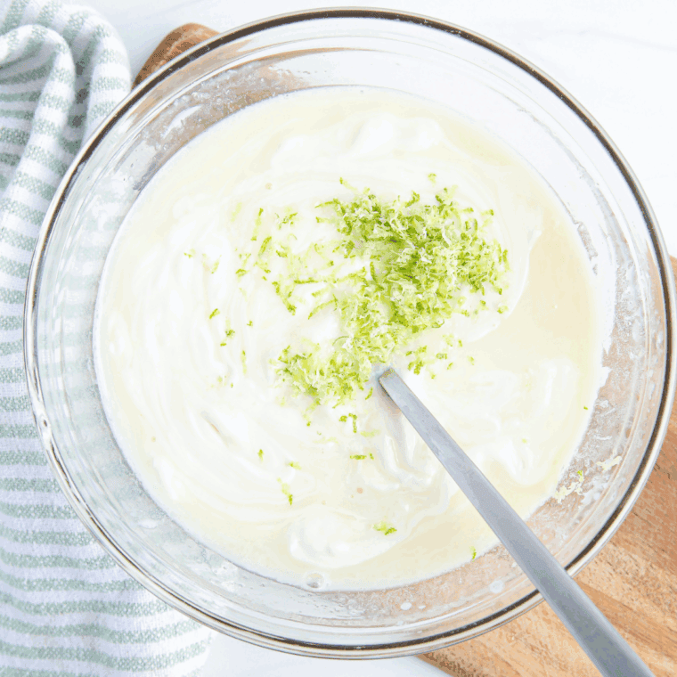 Homemade Key Lime Curd with fresh key limes, creamy texture, and tangy flavor.