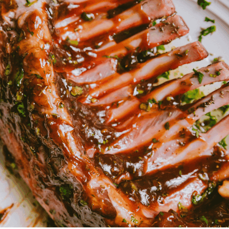 Coating lamb chops with marinade and refrigerating for flavor infusion.