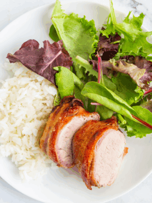 Ninja Air Fryer Bacon Wrapped Pork Tenderloin with crispy bacon and tender pork.