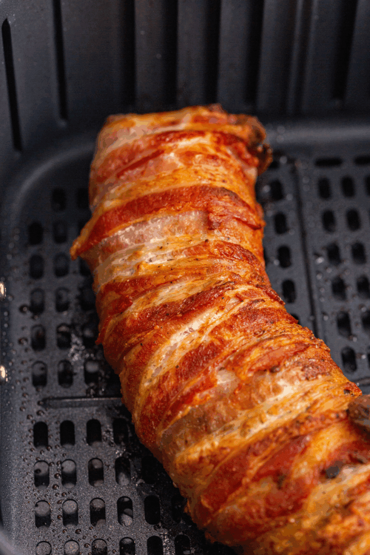 Ninja Air Fryer Bacon Wrapped Pork Tenderloin with crispy bacon and tender pork.