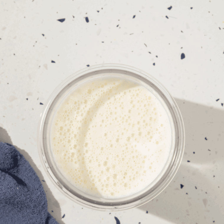 Blending milk, vanilla syrup, and lavender syrup until smooth and creamy.