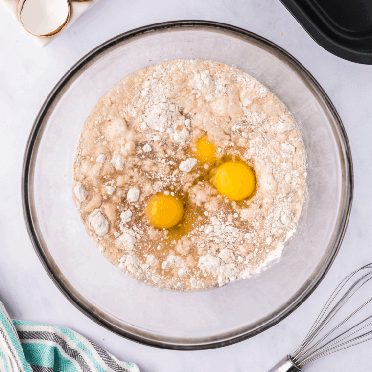 Mixing the ingredients in a large mixing bowl.