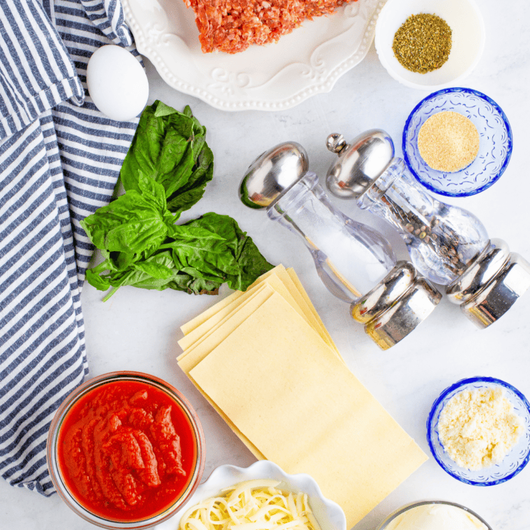 Ingredients needed for Olive Garden Lasagna Recipe on kitchen table.