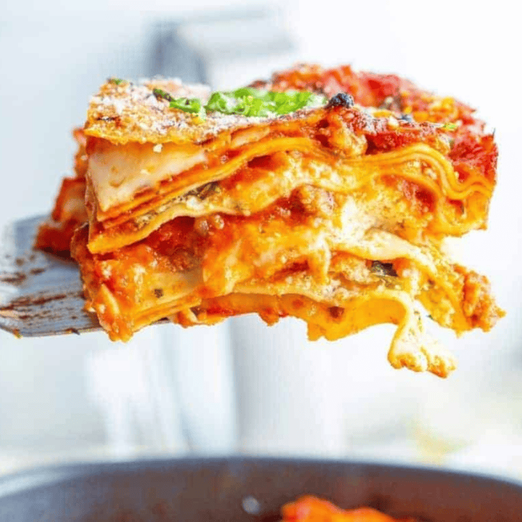 Homemade Olive Garden-style lasagna with layers of meat sauce, ricotta, mozzarella, and Parmesan, baked to perfection.