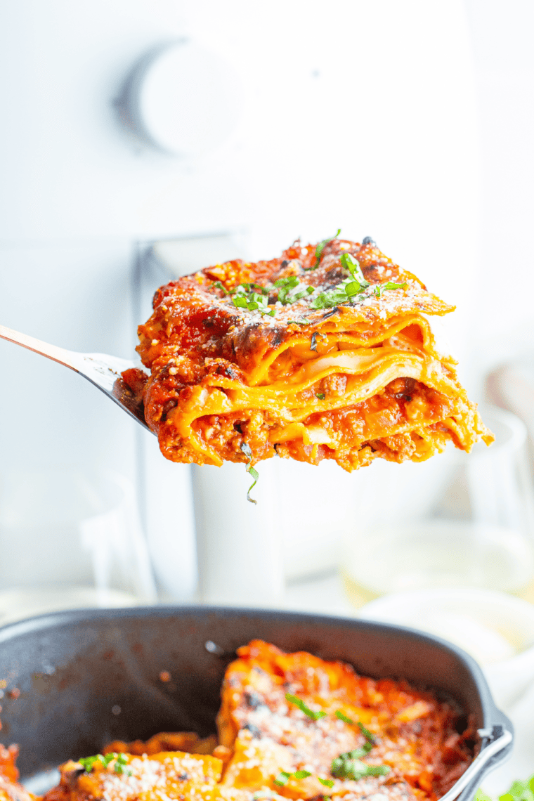 Homemade Olive Garden-style lasagna with meat sauce, ricotta, mozzarella, and Parmesan, perfectly baked for a comforting meal.