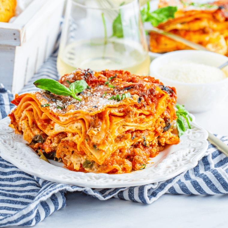 Homemade Olive Garden-style lasagna with layers of meat sauce, ricotta, mozzarella, and Parmesan, baked to perfection.