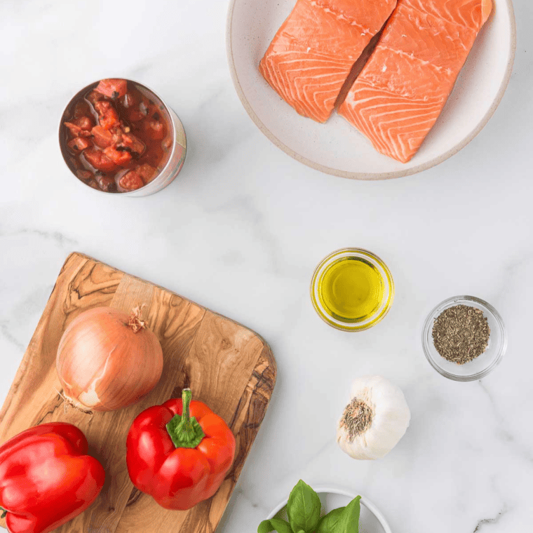 Ingredients needed for Olive Garden Salmon Bruschetta Recipe on kitchen table.