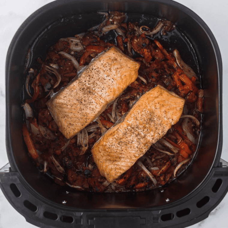 Cooked Olive Garden Salmon Bruschetta Recipe in the air fryer basket.