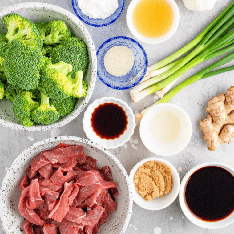 Ingredients needed for Sheet Pan Beef and Broccoli Freezer Meal on kitchen table.