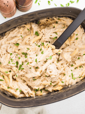 Slow Cooker Olive Garden Chicken Pasta with creamy Alfredo sauce and tender chicken.