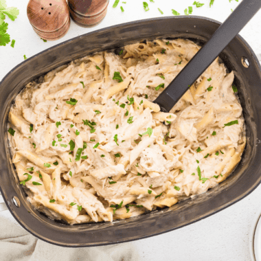 Slow Cooker Olive Garden Chicken Pasta with creamy Alfredo sauce and tender chicken.