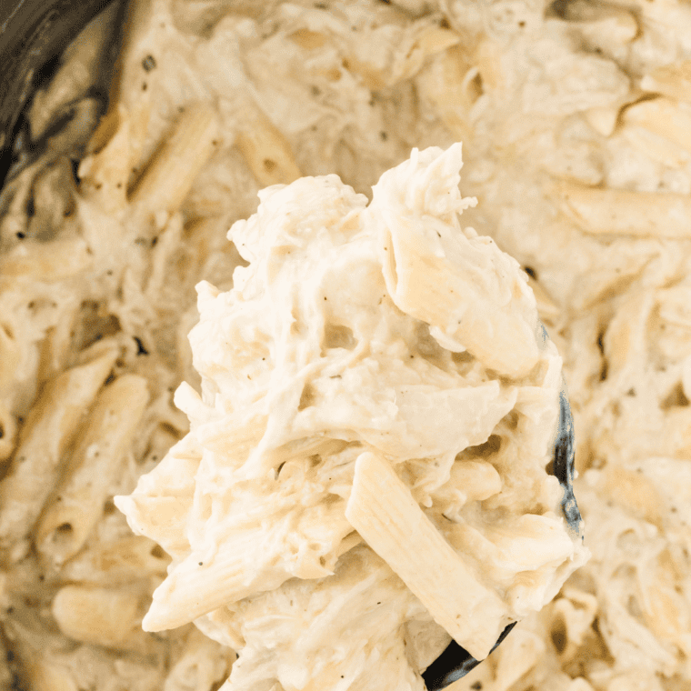 Slow Cooker Olive Garden Chicken Pasta with creamy sauce and tender chicken.