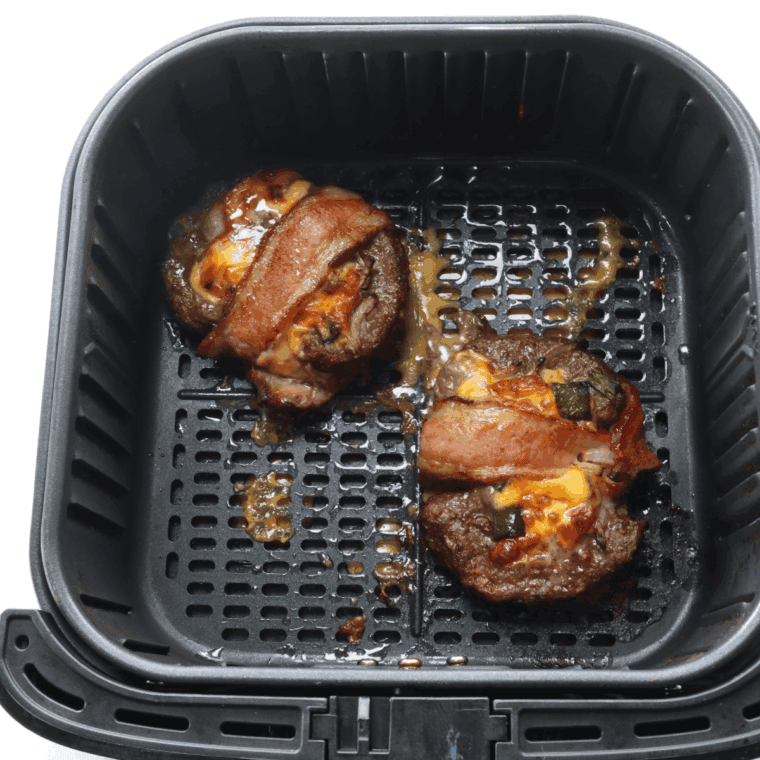 Cooked Beer Can Burger in the air fryer basket.