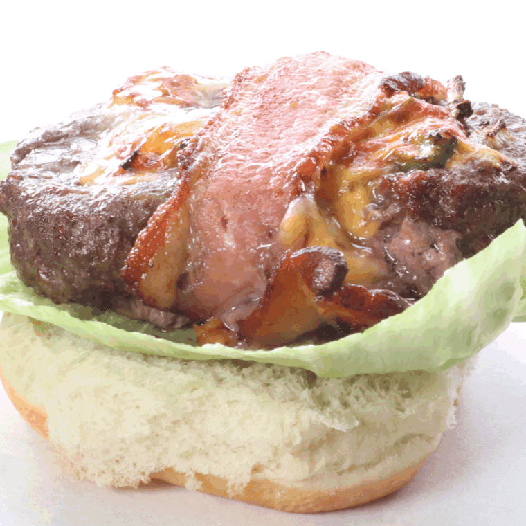 Cooked bacon beer burger on plate.