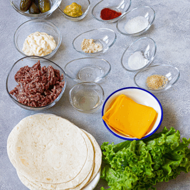 Ingredients needed for Air Fryer Big Mac Smash Tacos on kitchen table.