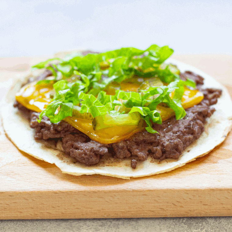 Air Fryer Big Mac Smash Tacos with juicy ground beef, cheese, pickled cucumbers, lettuce, and a creamy Big Mac-inspired sauce.