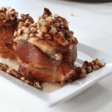 Air Fryer Bourbon Bacon Cinnamon Rolls with a crispy exterior, gooey cinnamon filling, and topped with crispy bacon and a hint of bourbon.