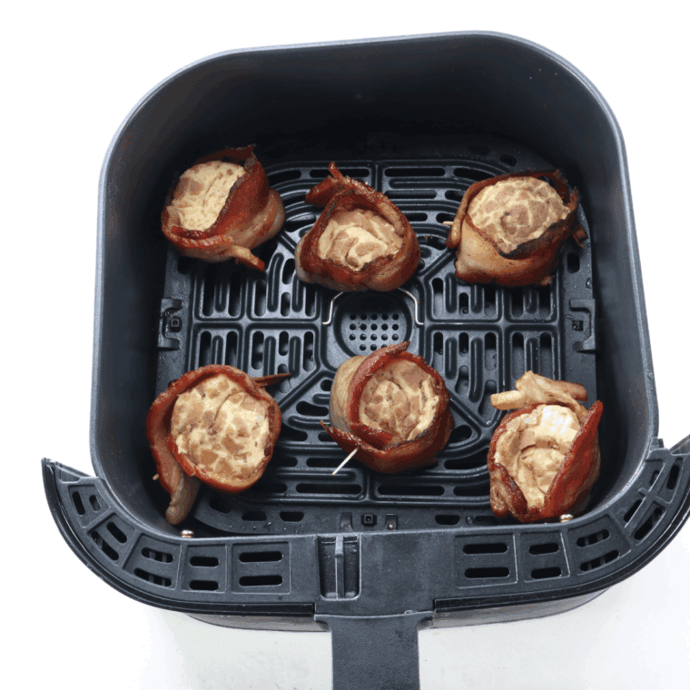 Place Bourbon Bacon Cinnamon Rolls in the air fryer basket.