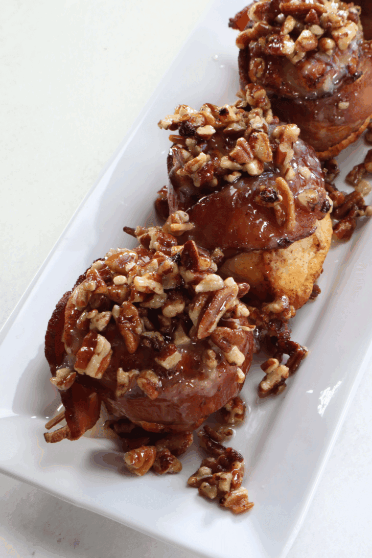 Air Fryer Bourbon Bacon Cinnamon Rolls with crispy bacon, bourbon-soaked dough, and a sweet maple-pecan topping, air-fried to golden perfection.