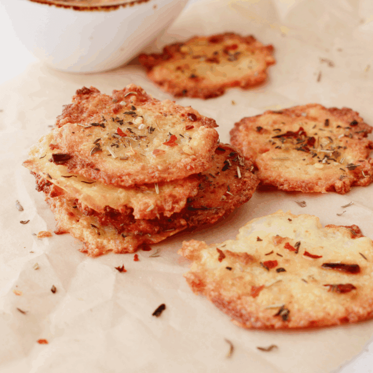 Crispy, golden Air Fryer Cottage Cheese Chips, seasoned with garlic, chili flakes, and Italian herbs for a savory, protein-packed snack.