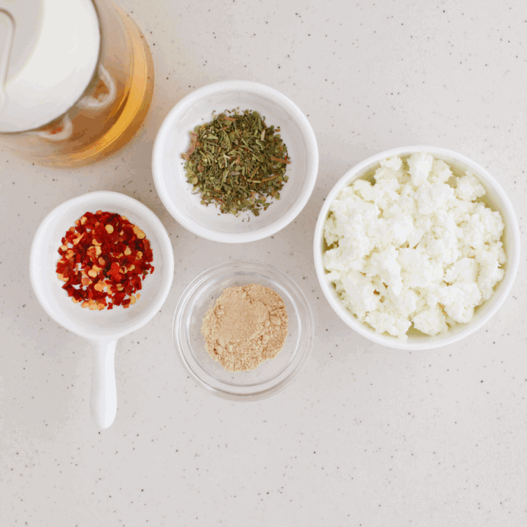 Ingredients needed for Air Fryer Cottage Cheese Chips on kitchen table.
