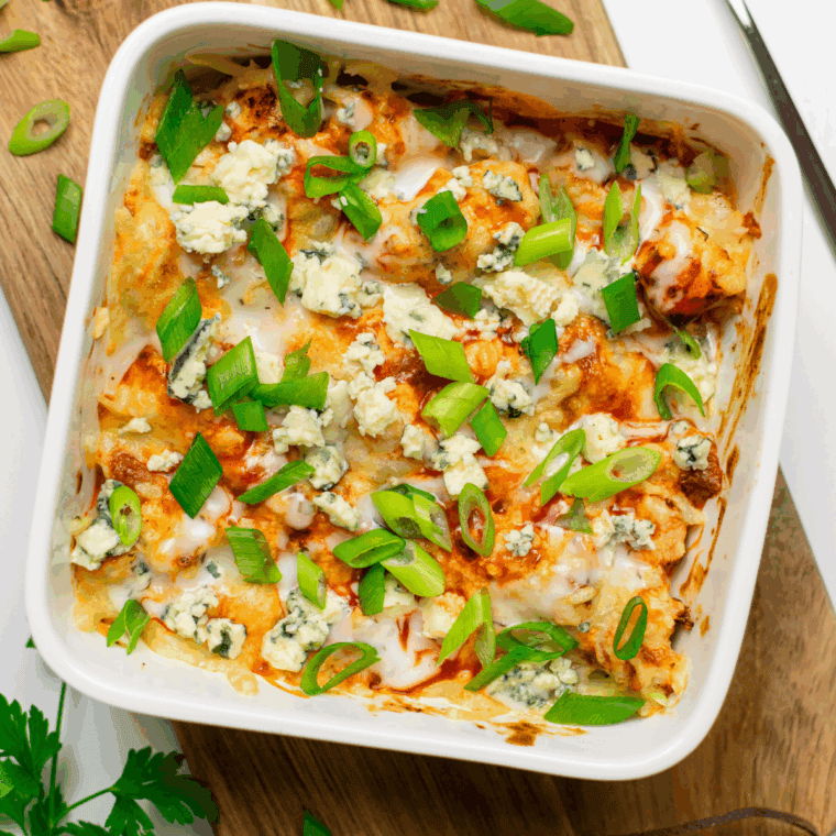 Air Fryer Domino's Hot Buffalo Chicken Bake with buffalo-coated chicken, creamy dressing, melted mozzarella and cheddar cheese.