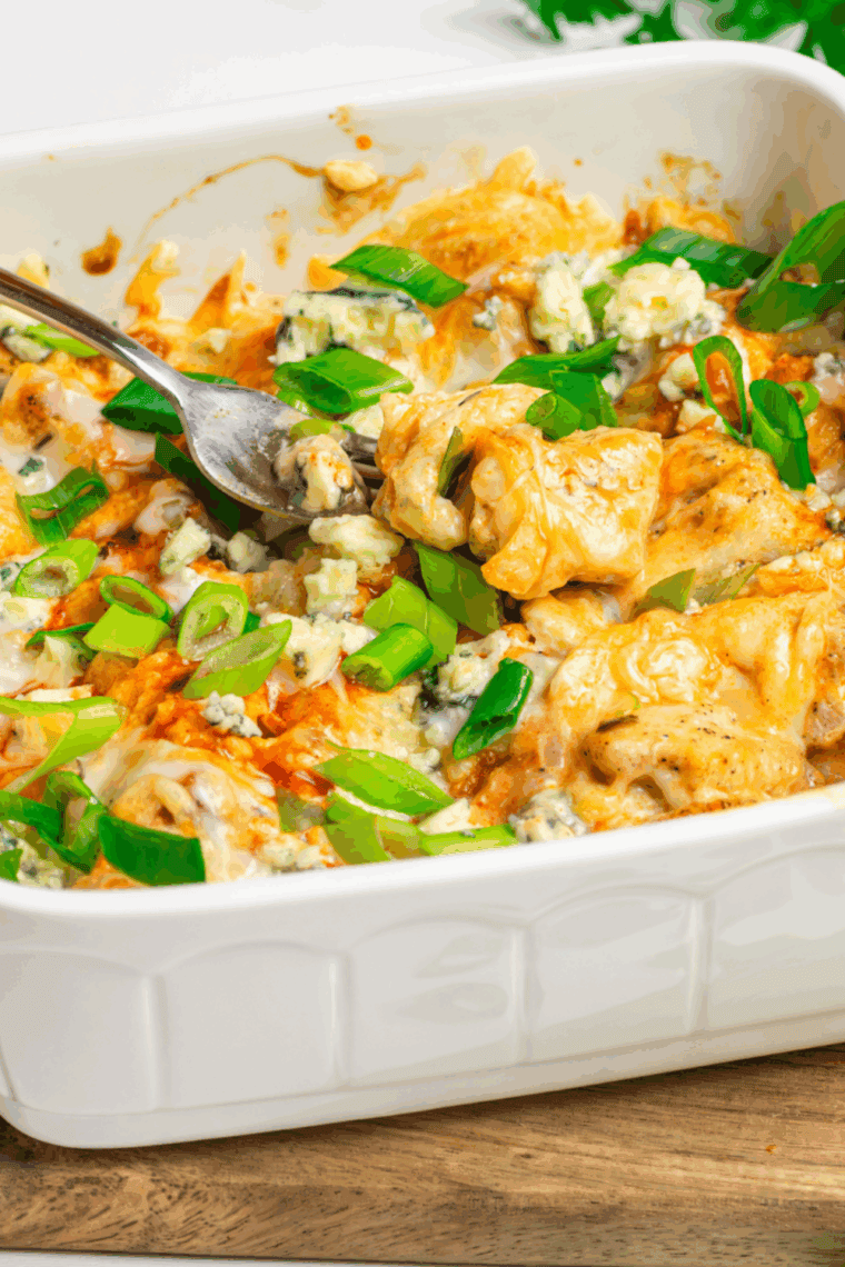 Air Fryer Domino's Hot Buffalo Chicken Bake with buffalo-coated chicken, creamy dressing, melted mozzarella and cheddar cheese.