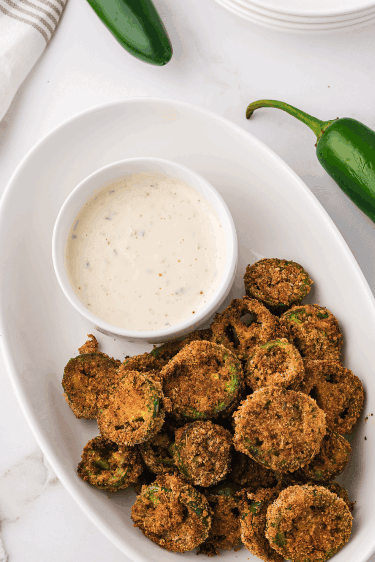 Golden, crispy air taco coins are painted on Parmesan crumbs and serve spicy and crunchy snacks inspired by Red Robin’s famous appetizer.