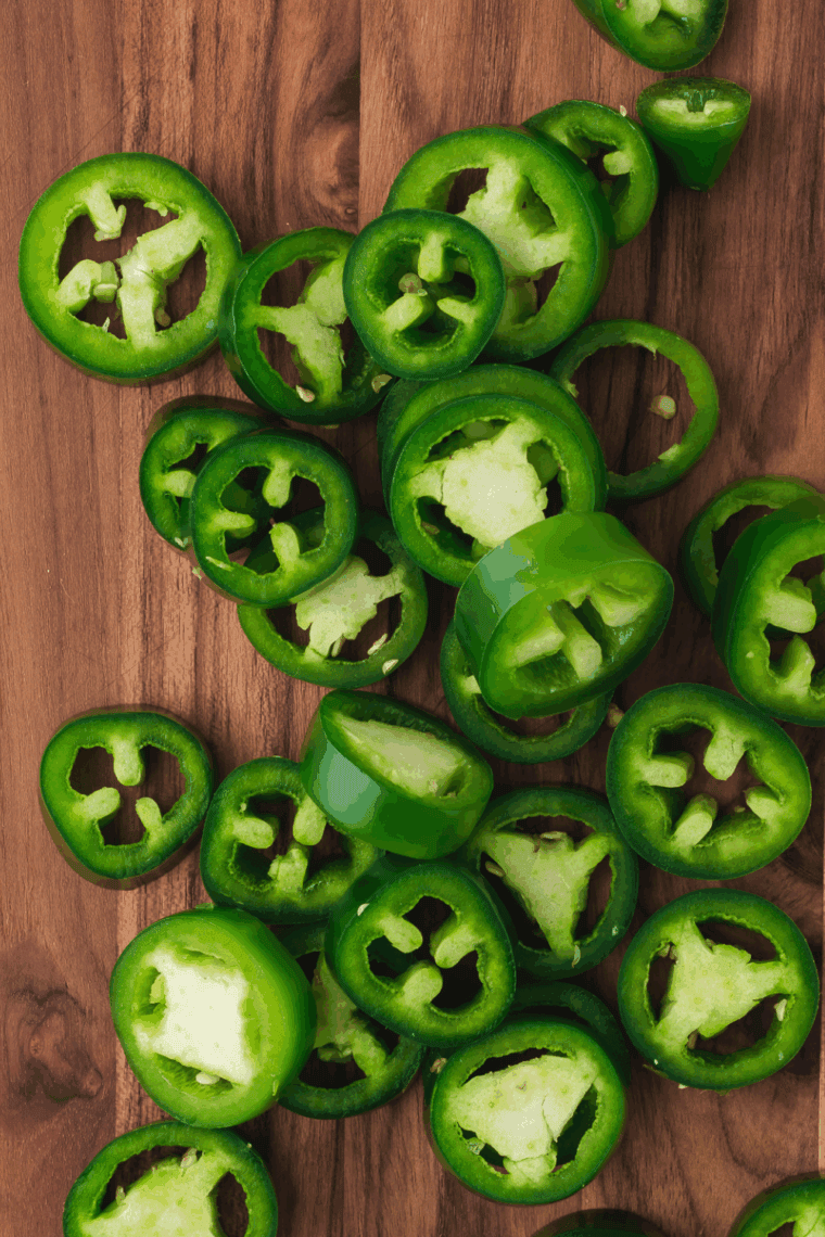Cut the jalapeno into thin slices: Cut the fresh jalapeno slices into 1/4-inch thick circles and remove the seeds with milder heat.
