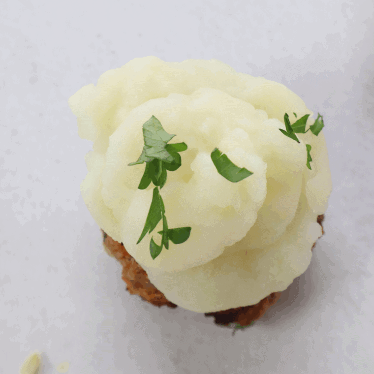 Air Fryer Meatloaf Cupcakes with Whipped Potato Topping, individual meatloaf servings topped with creamy whipped potatoes, all cooked to perfection in the air fryer for a hearty and fun meal.