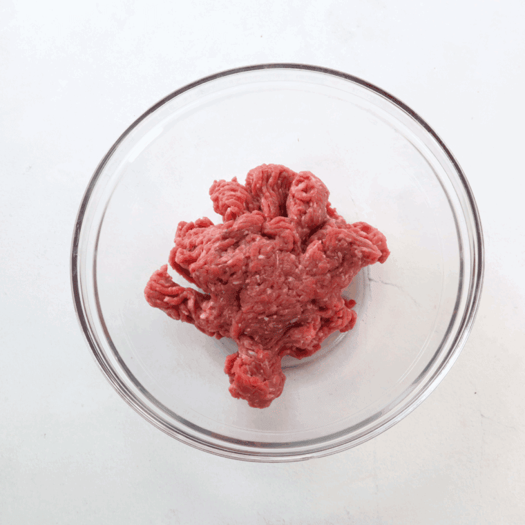 Add ground beef to the mixing bowl.