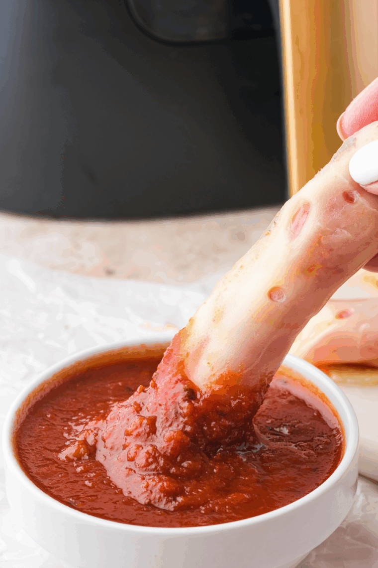 Golden, crispy Air Fryer Pepperoni Cheese Crisps made with mozzarella cheese and pepperoni, ready to be enjoyed with your favorite dipping sauce.