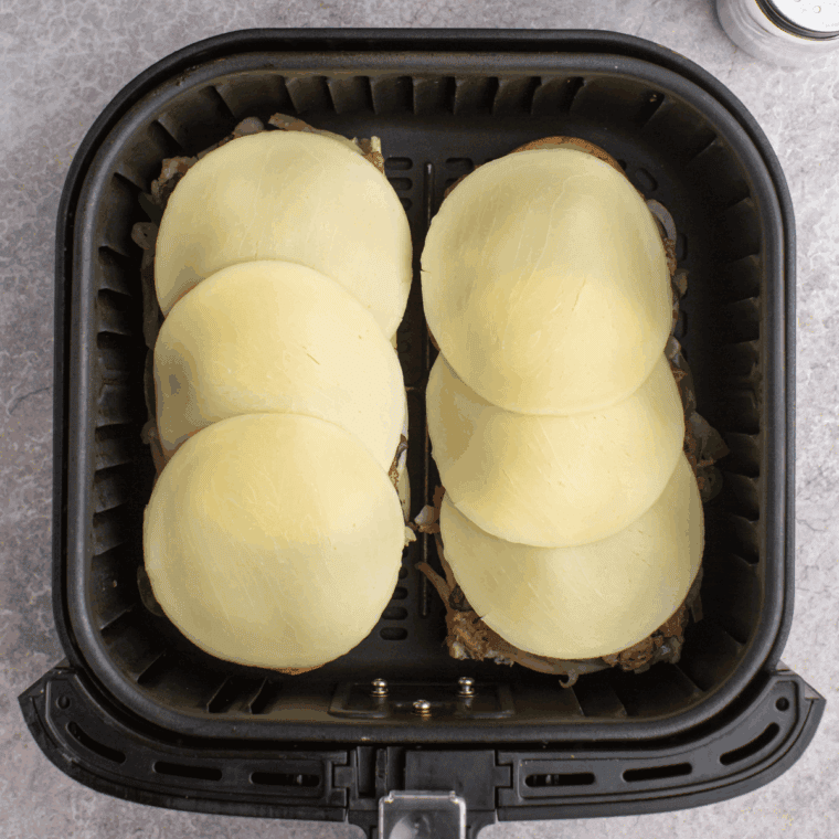 Air Fryer Philly Cheesesteak Cheesy Bread into the air fryer basket, until the cheese has melted.