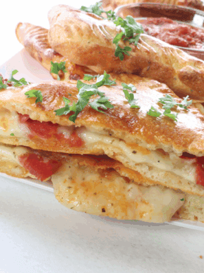 Air Fryer Pizza Turnovers with gooey cheese and savory pizza fillings, perfectly golden and crispy.