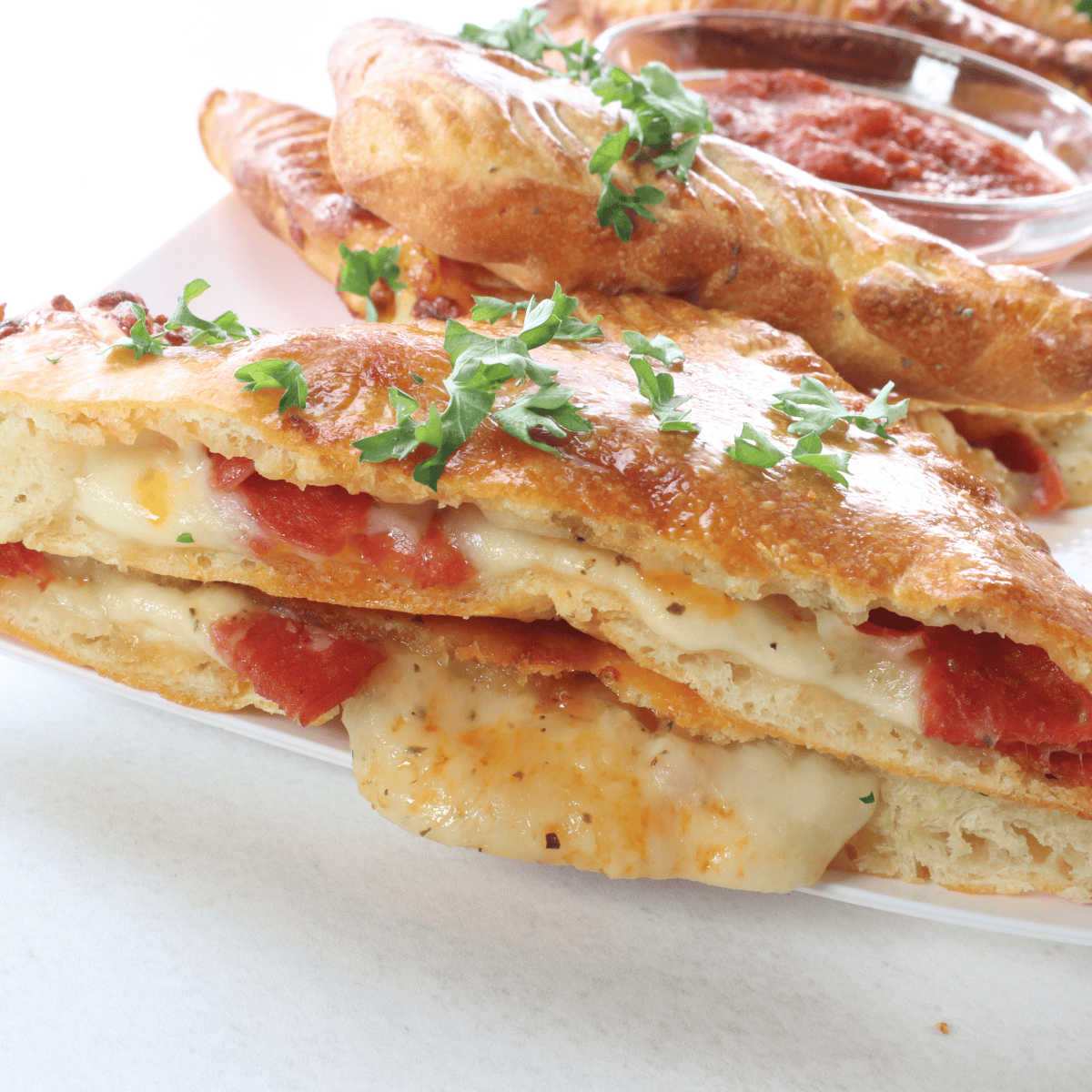 Air Fryer Pizza Turnovers with gooey cheese and savory pizza fillings, perfectly golden and crispy.