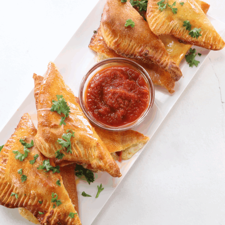 Close up picture of air fryer pizza turnovers.