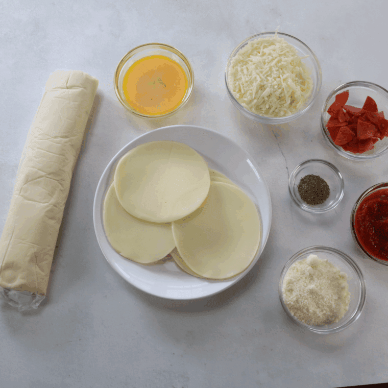 Ingredients needed for Air Fryer Pizza Turnovers on kitchen table.