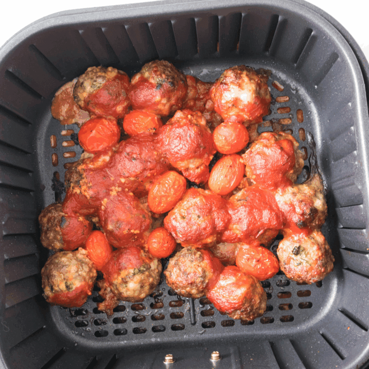 Add the tomato sauce on top of the meatballs.