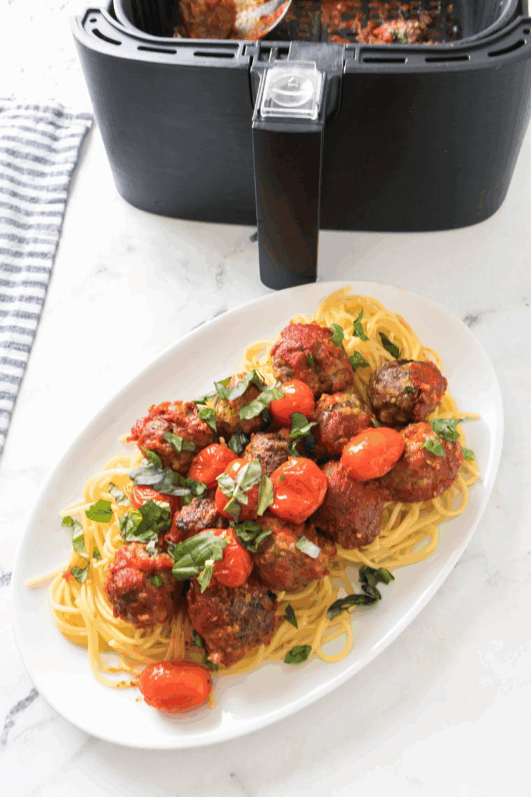 Crispy Air Fryer Spaghetti and Meatballs with marinara sauce, ready to serve for a comforting and tasty dinner.
