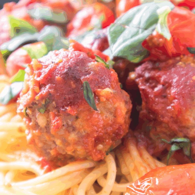 Air Fryer Spaghetti and Meatballs, featuring crispy meatballs and perfectly cooked pasta, ready to serve with marinara sauce.